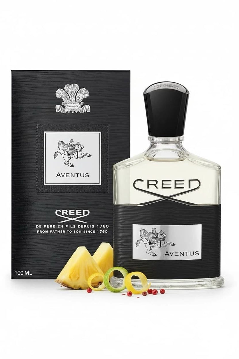 Creed Aventus 100ml bottle and black box with fruit in the foreground